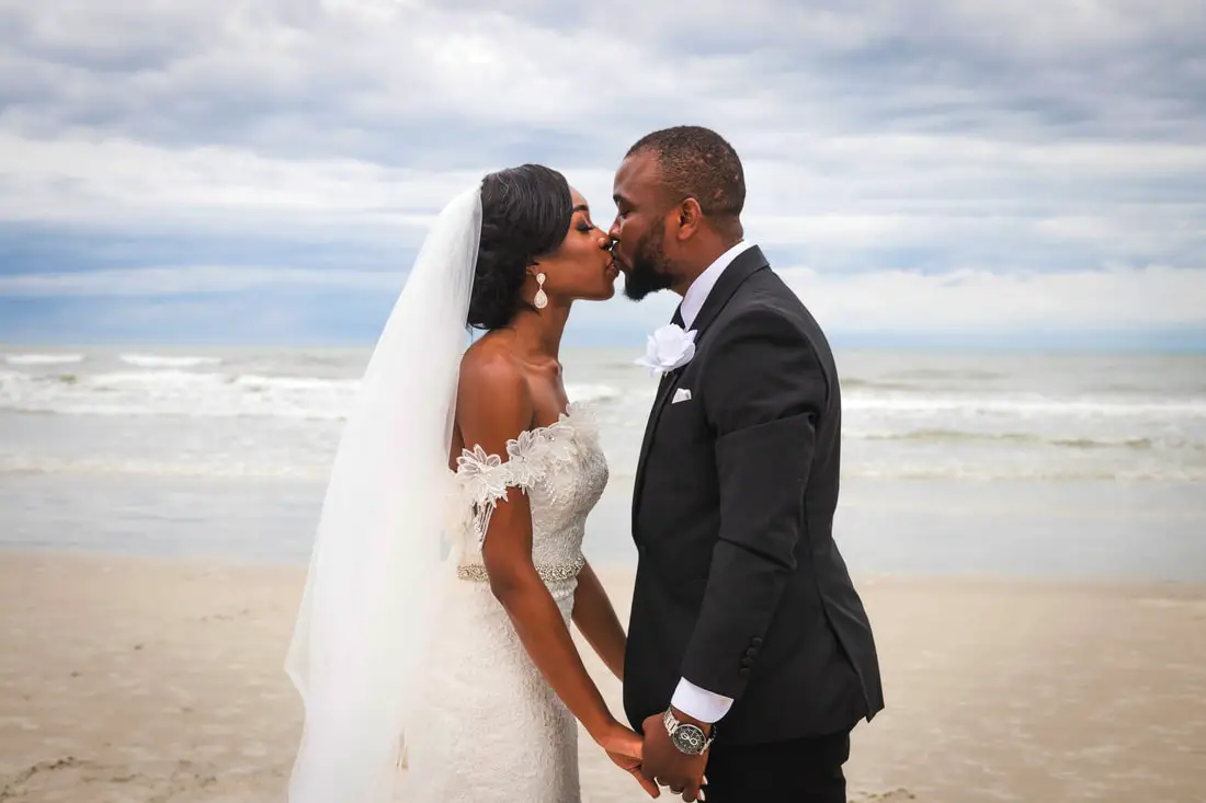 Wedding couple kisses on Florida Beach