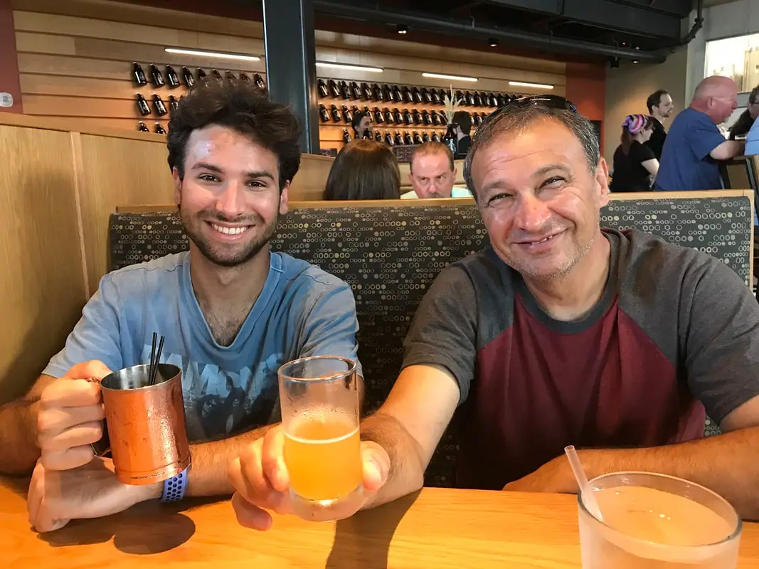 Two men drink beer at Rock Bottom Daytona Beach