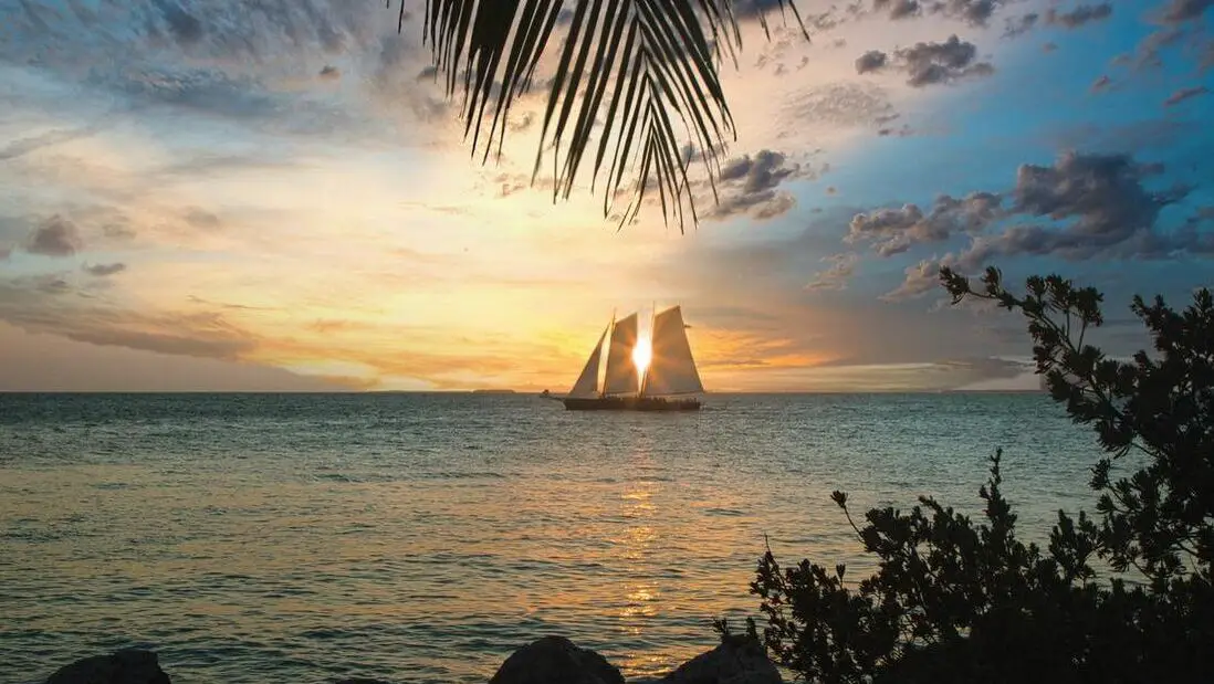 Ship sails in Key West Fl at sunset