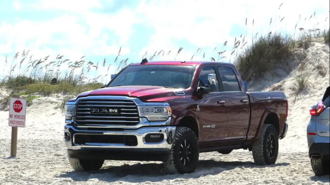 Picture of red Dodge Ram truck on beach