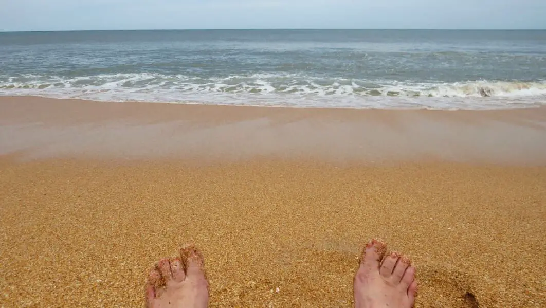 Picture of feet in Flagler Beach sand
