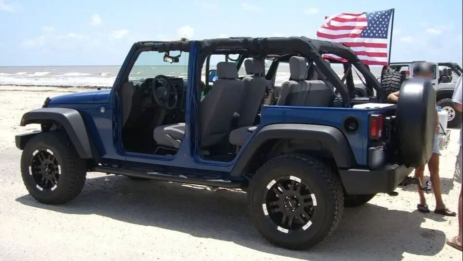 Jeep Wrangler on Daytona Beach with American Flag