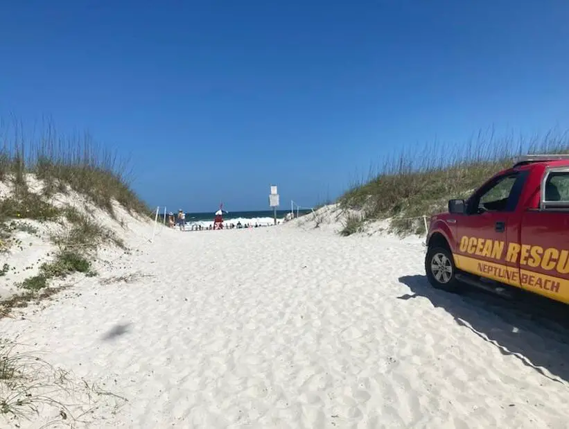 Neptune Beach sand dunes and rescue truck