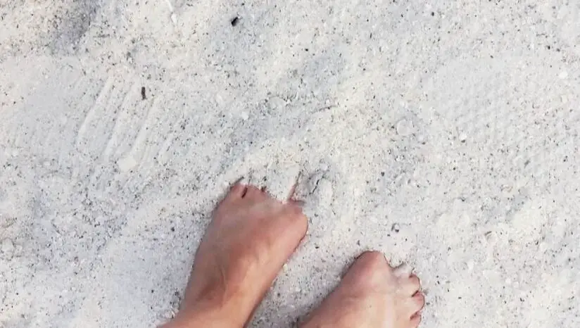 Feet in St. Pete Beach white sand