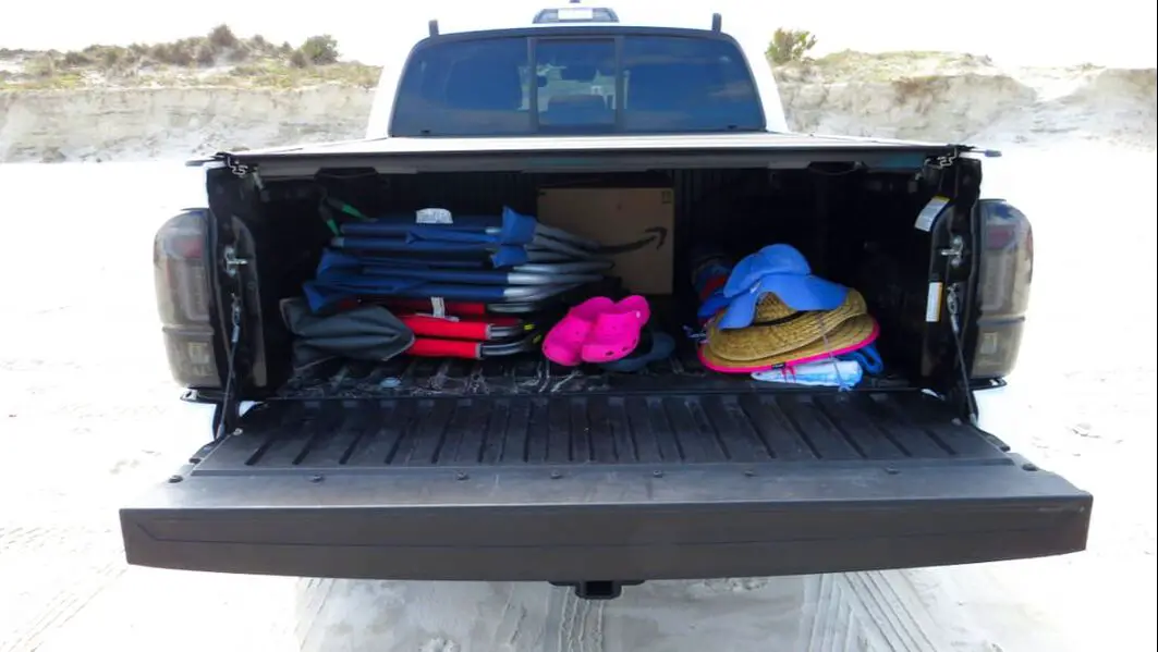 Pickup truck back open with beach gear